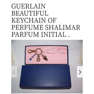 NIB RARE GUERLAIN Bag Charm Keychain Gold Toned Charms With pink  Ribbon